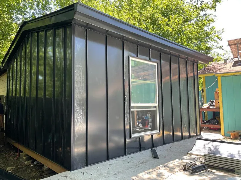Black standing seam metal wall panels for Metal Roof Installation in Fort Stewart